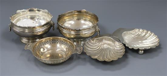 A pair of 1920s/1930s small silver rose bowls, by Adie Brothers, two silver shell butter dishes and a pierced silver silver dish.